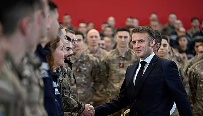 French President Emmanuel Macron shakes hands with soldiers as he visits the Istres military air force base in southern France, January 15, 2026. – Reuters