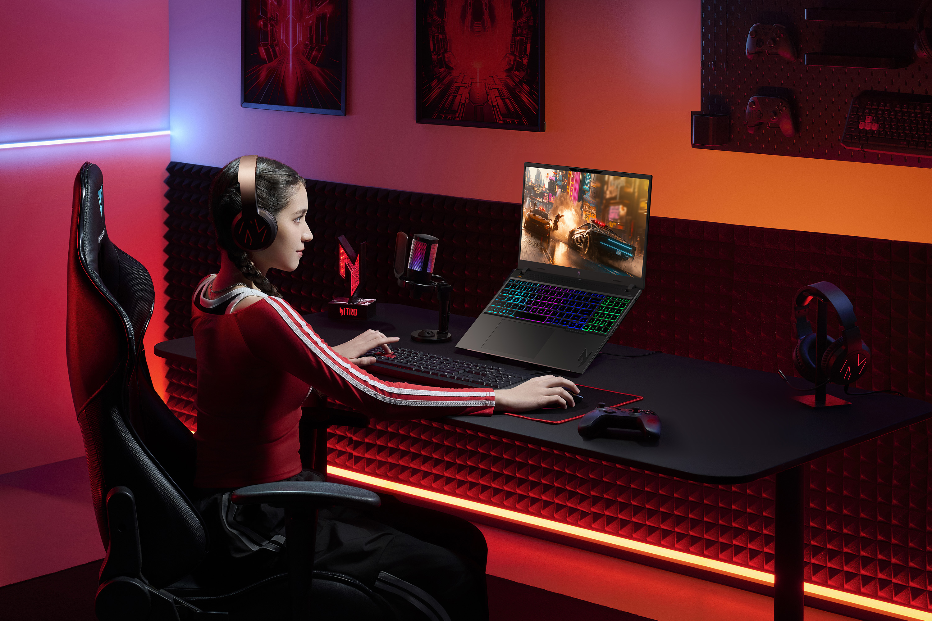 A woman using the Acer Nitro V 16 AI gaming laptop.