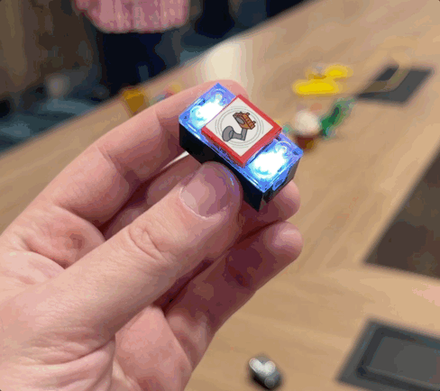 Lego Smart Brick with Smart Tag in hand