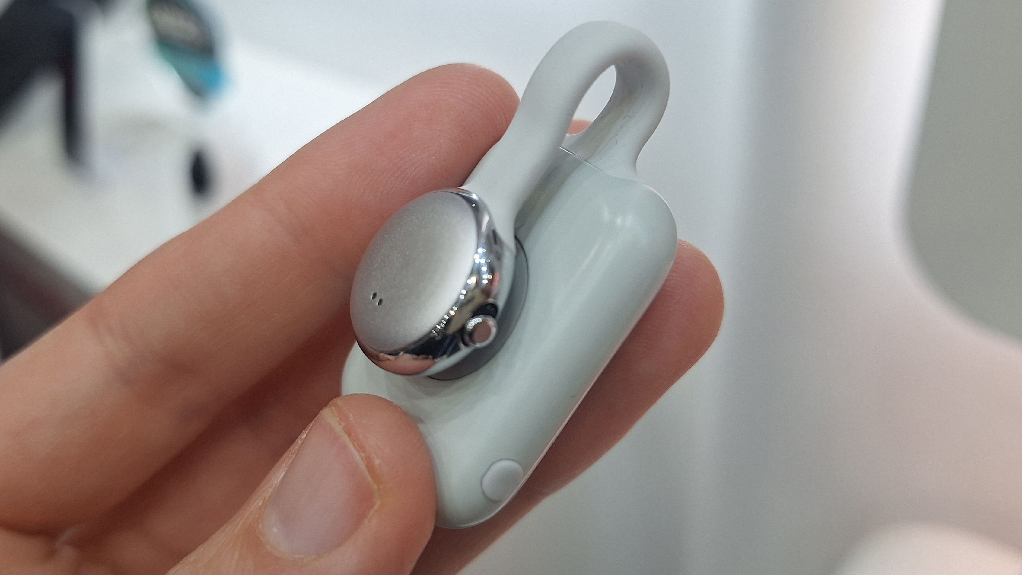 SwitchBot AI MindClip in the writer's hand