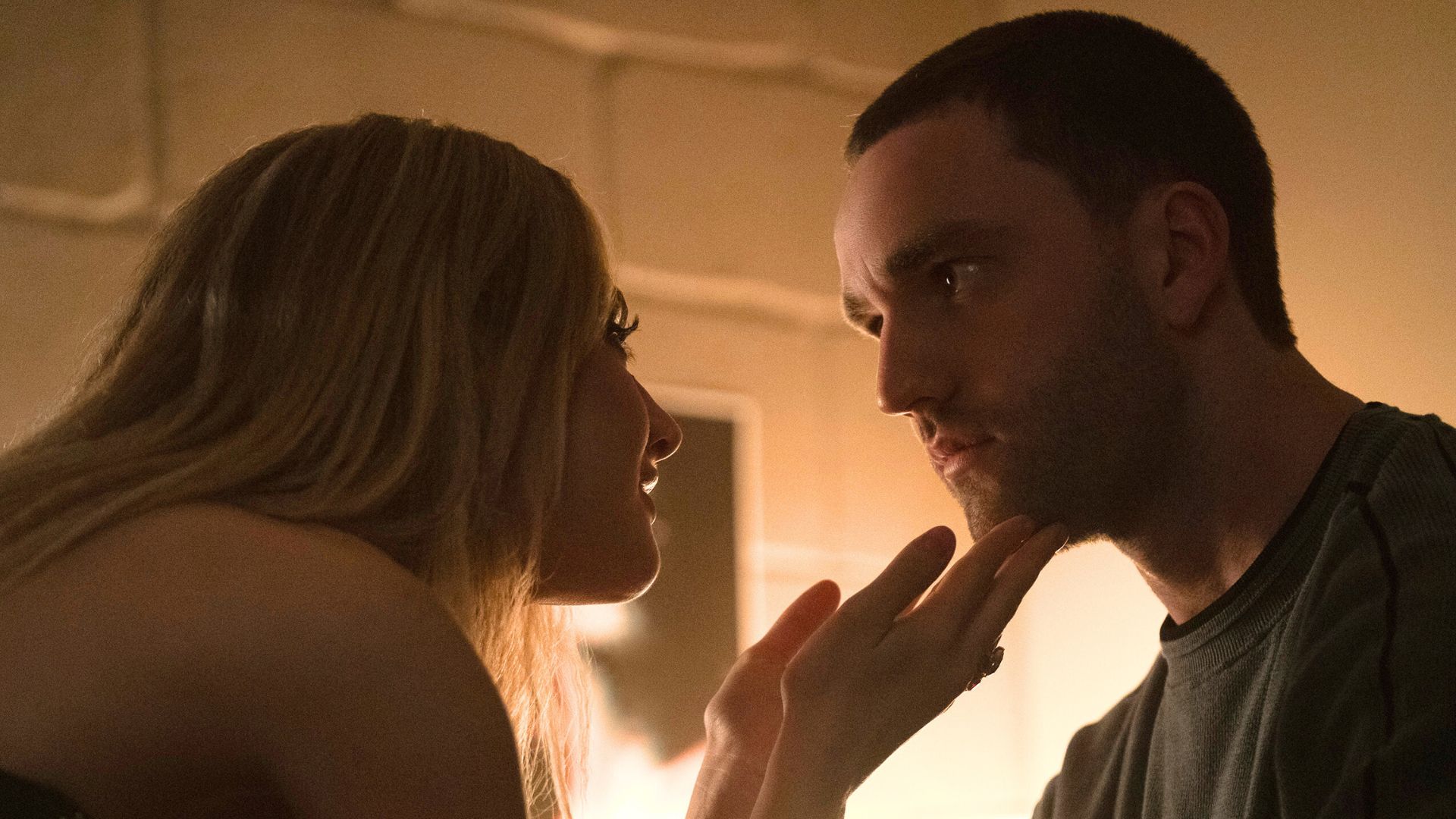 Lucy holds Stephen's face.