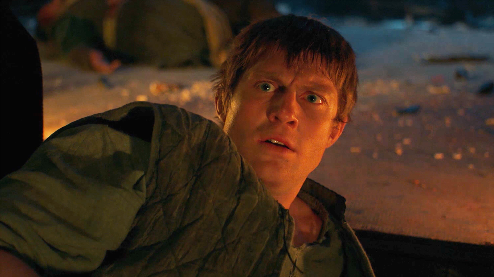 A bewildered Dunk lying on the ground and staring at an egg off-camera in episode 3 of A Knight of the Seven Kingdoms.