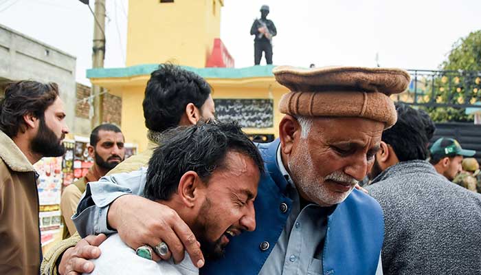 A man reacts as he is comforted after a deadly explosion at a mosque in Islamabad, February 6, 2026. - Reuters