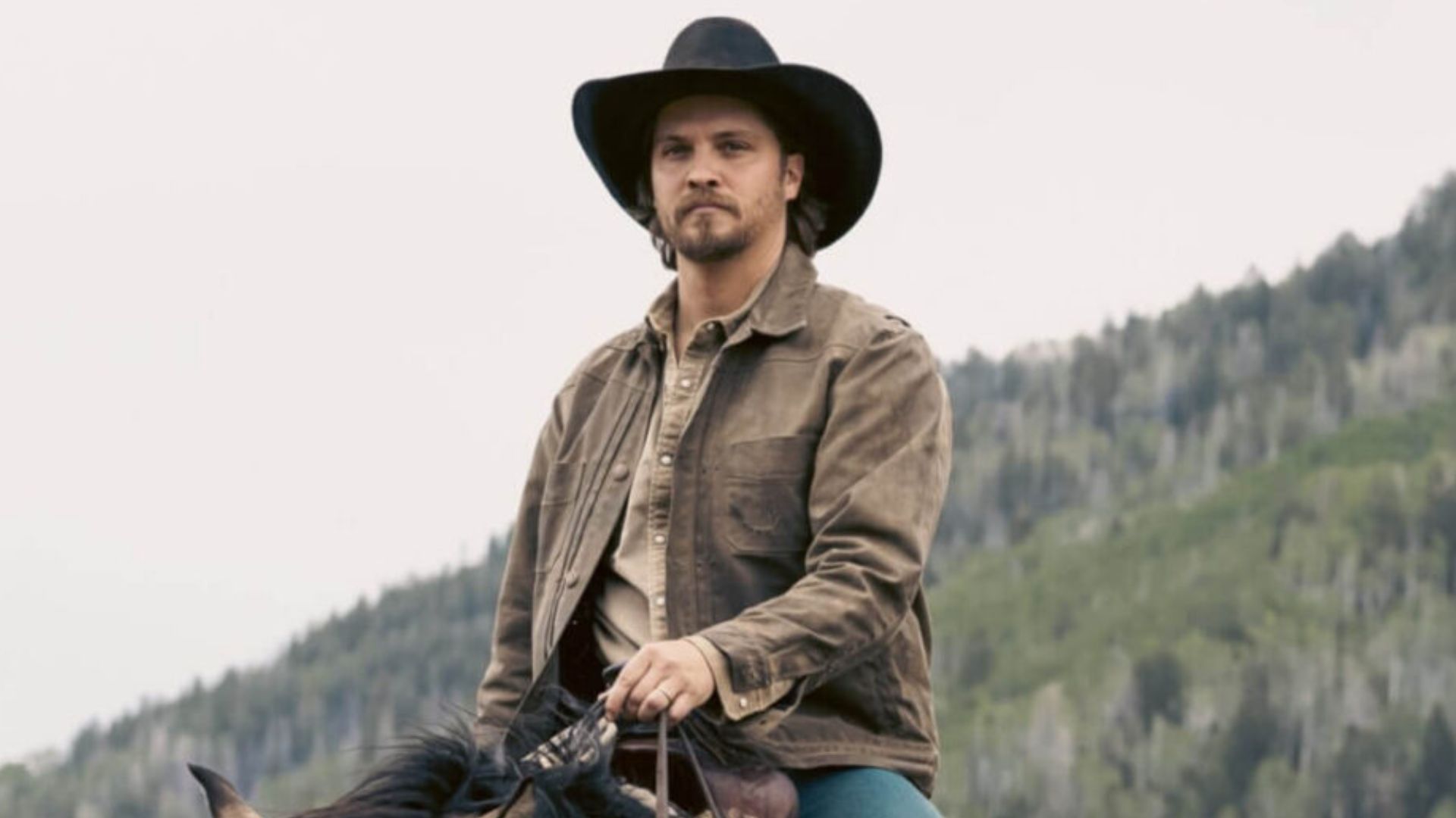 Luke Grimes sitting on a horse