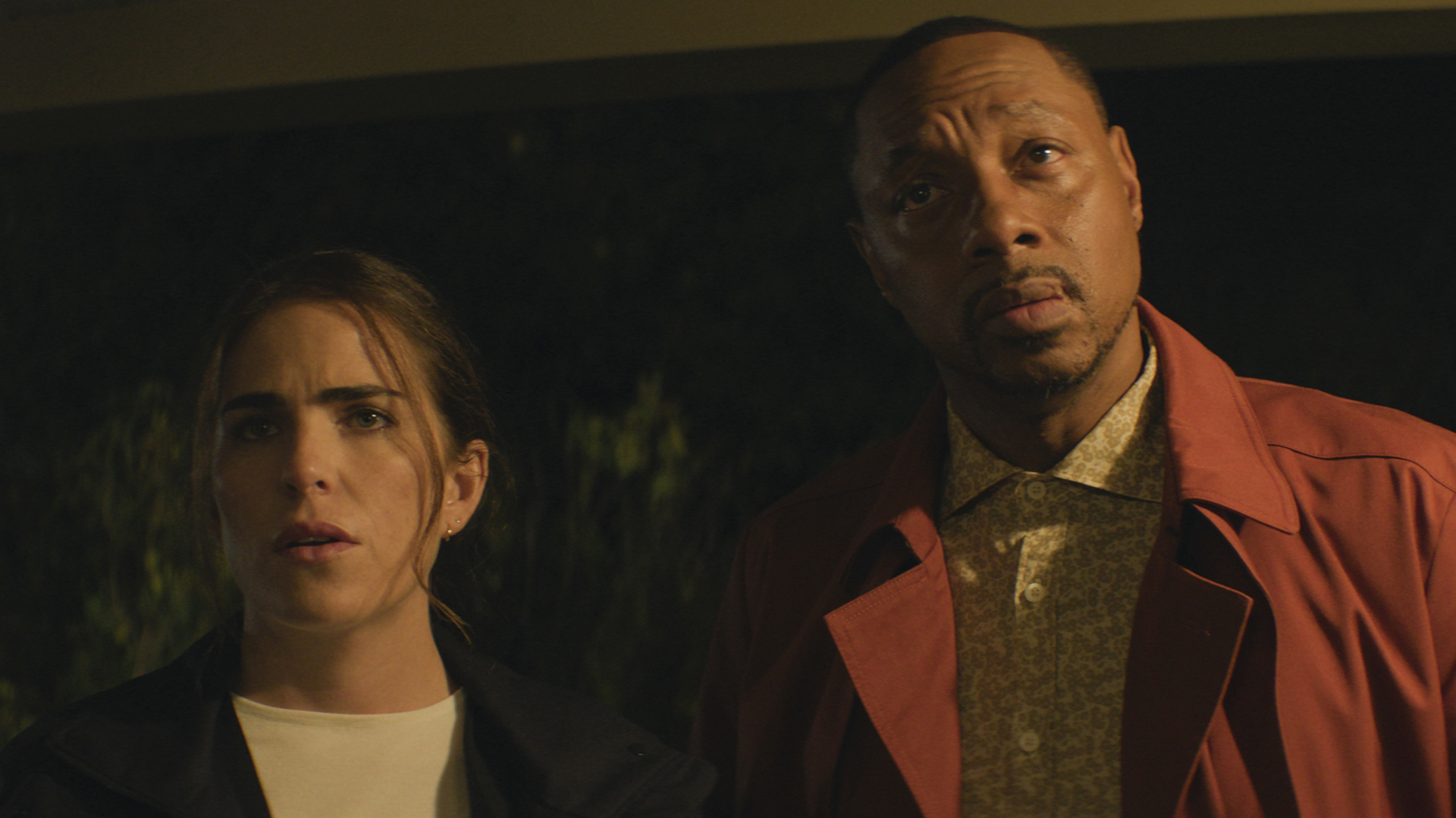 Lee and Karl watch something that's off camera in 56 days