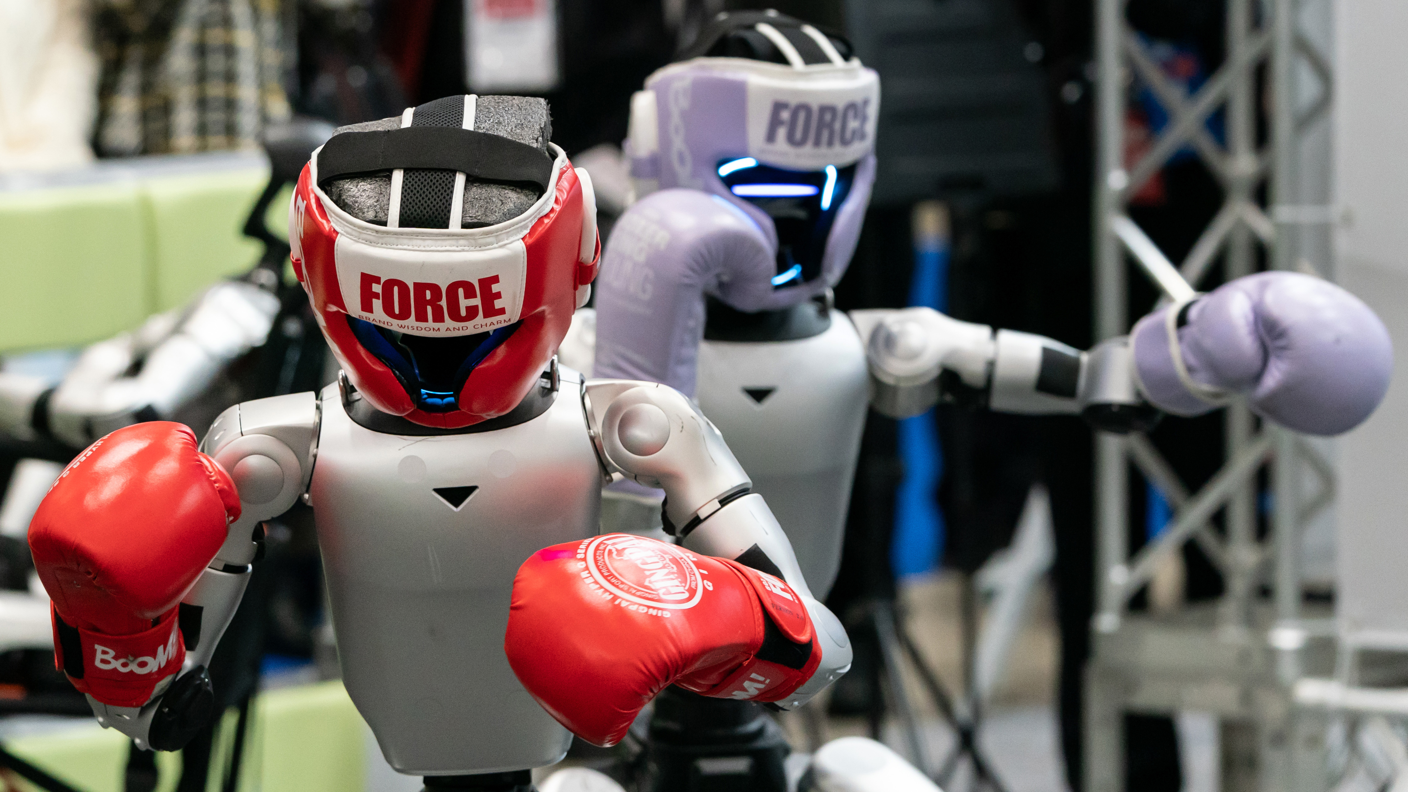 Two Unitree G1 robots with boxing gloves