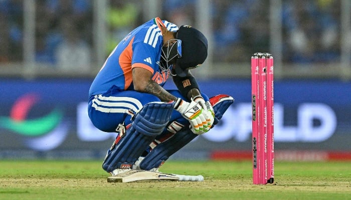 India captain Suryakumar Yadav reacts after being hit by the ball during the ICC Mens T20 Cricket World Cup 2026 Super Eights match between India and South Africa at the Narendra Modi Stadium in Ahmedabad on February 22, 2026. – AFP