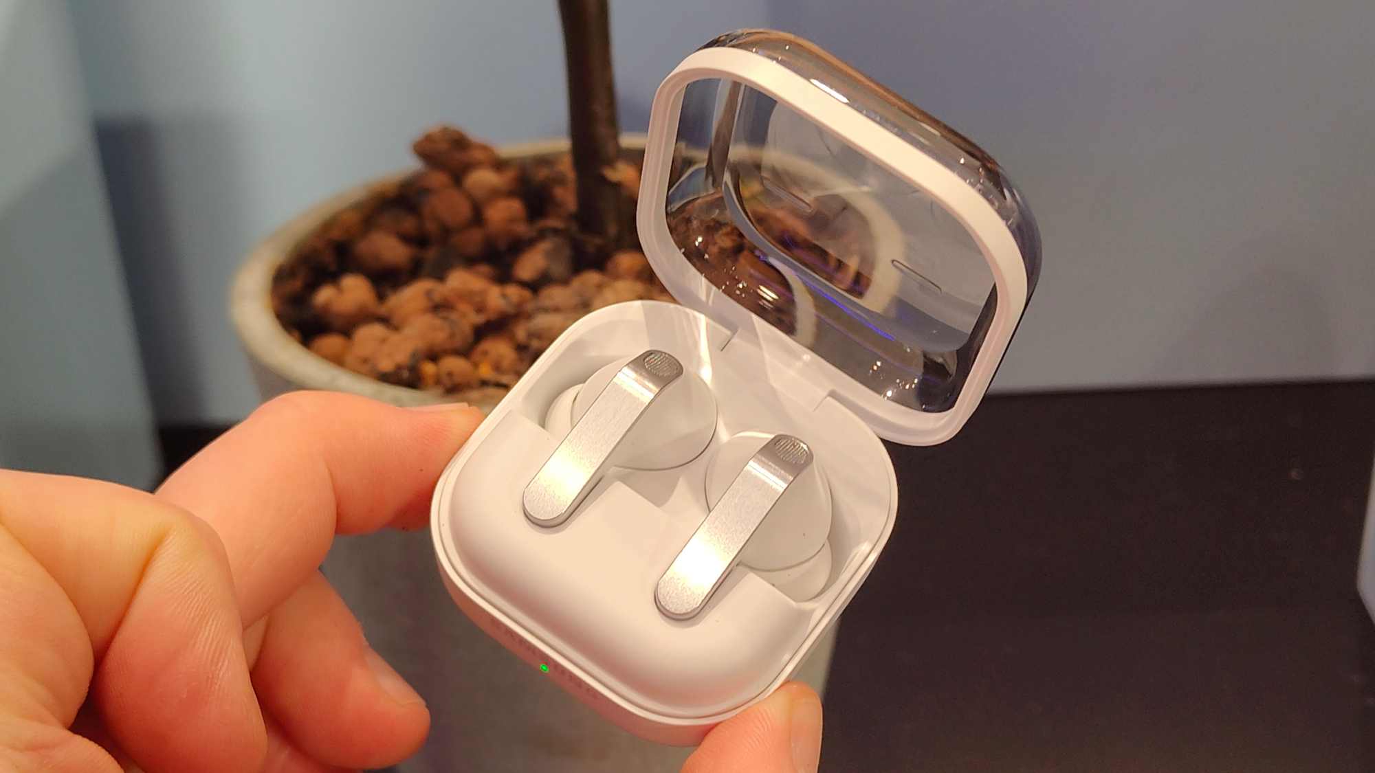 The Samsung Galaxy Buds 4 Pro in their carrying case.
