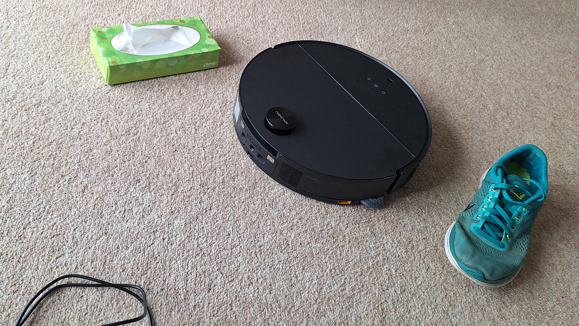Roborock Saros 10 robot vacuum cleaner avoiding a shoe