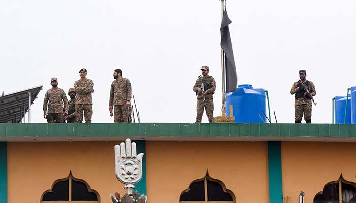 Army soldiers stand guard on the roof after a deadly explosion at an imambargah in Islamabad, February 6, 2026. – Reuters