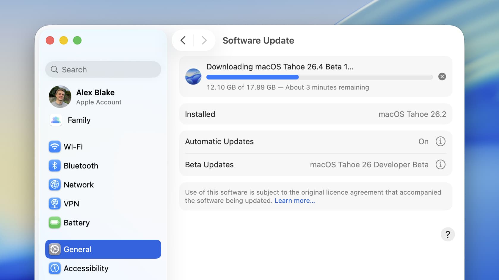 Downloading a software update in the System Settings app in macOS Tahoe 26.