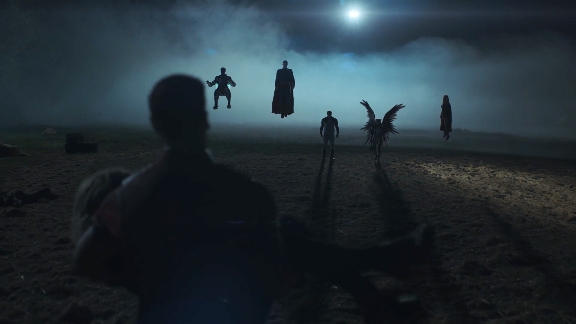A silhouette of the Justice Gang, Superman, and Supergirl at night in Peacemaker Season 2 Episode 1
