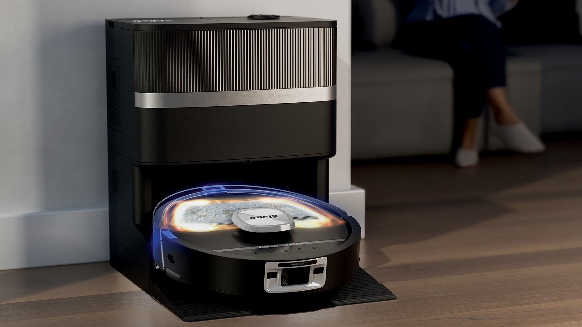 Graphic showing the Shark PowerDetect UV Reveal robot vacuum cleaner cleaning a room