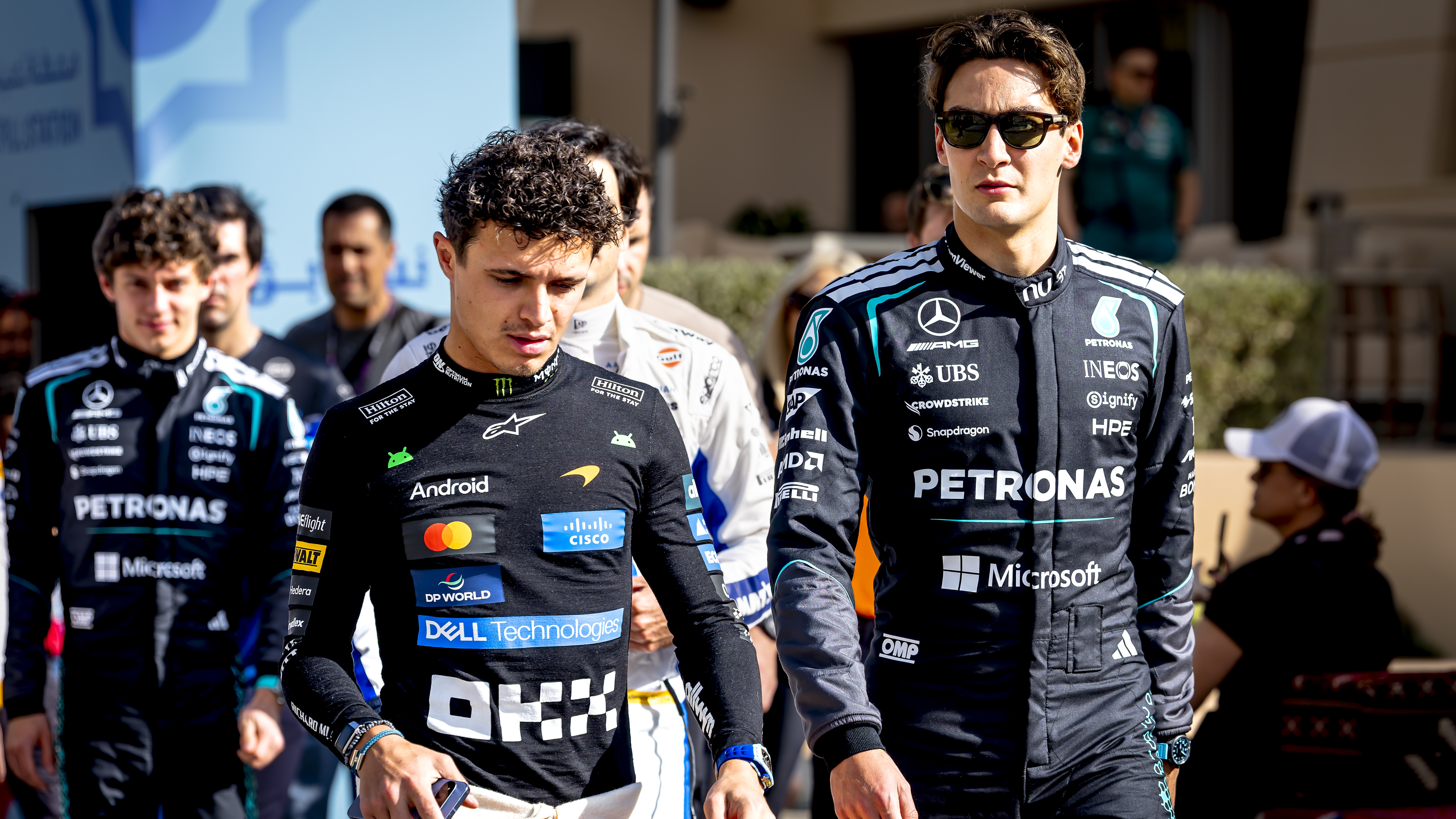 Formula 1 driver Lando Norris of the McLaren Mastercard Formula 1 team and Formula 1 driver George Russell of the Mercedes AMG-Petronas Formula One team take part in Formula 1 pre-season testing at the Bahrain International Circuit for the 2026 season in Sakhir, Bahrain, on February 12, 2026.