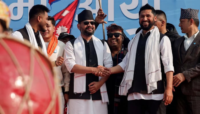 Balendra Shah, former mayor of Kathmandu popularly known as Balen, who party officials say will become prime minister under an internal agreement if the Rastriya Swatantra Party (RSP) wins the March 5 election, shakes hands with Rabi Lamichhane, president of the Rastriya Swatantra Party (RSP) during an election campaign in Janakpur, Nepal, January 19, 2026. – Reuters
