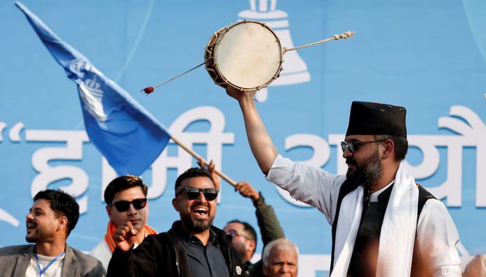 Balendra Shah, former Kathmandu mayor popularly known as Balen, who party officials say will become prime minister under an internal agreement if the Rastriya Swatantra Party (RSP) wins the March 5 election, plays a damru percussion instrument during an election campaign in Janakpur, Nepal, January 19, 2026. – Reuters