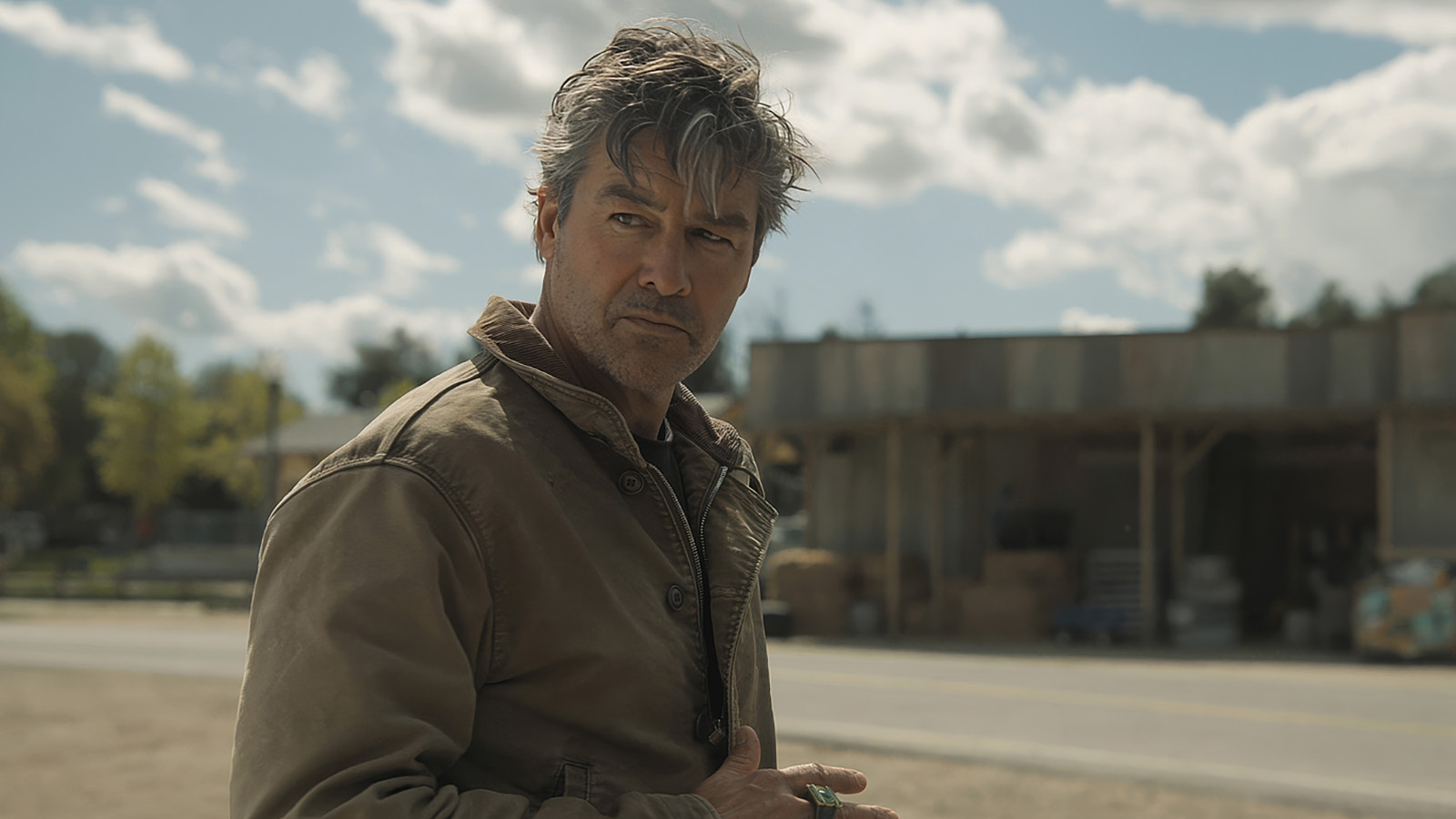 Hal Jordan looking over his right shoulder on the HBO television show Lanterns