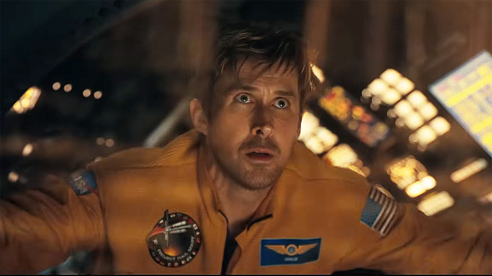 Ryan Gosling's Ryland Grace looking out a spaceship window into space in Project Hail Mary