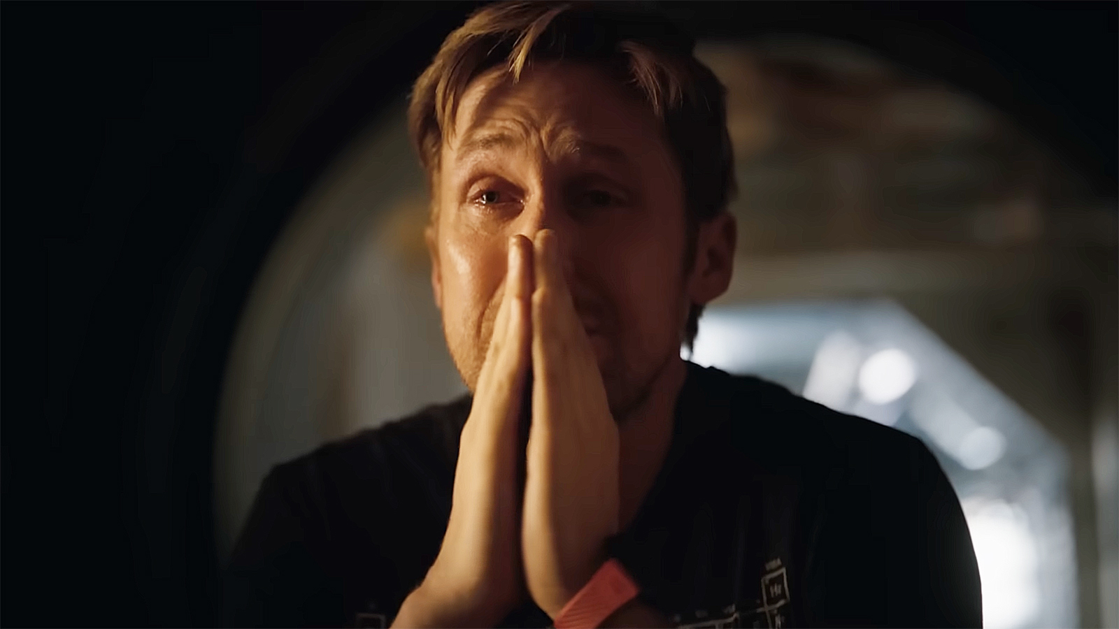 Ryland Grace crying and praying at Project Ave Maria