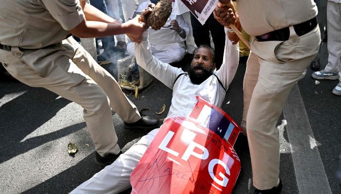 Indian Opposition Congress party workers stage a protest against rising prices and shortages of liquefied petroleum gas (LPG) in New Delhi on March 13, 2026. — AFP