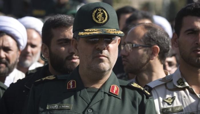 The head of the ground forces of Iran's Revolutionary Guard, Mohammad Pakpour (C), attends a funeral ceremony in Tehran, October 20, 2009. - Reuters