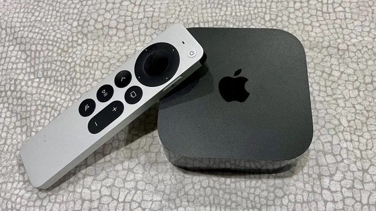 An Apple TV 4K on the floor.