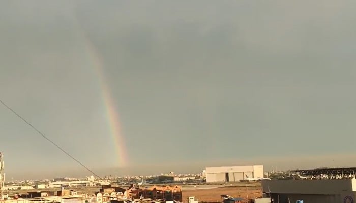 A photograph shows rainbow hues in the sky over Karachi after heavy rain, on April 2, 2026. – PakGazette.tv