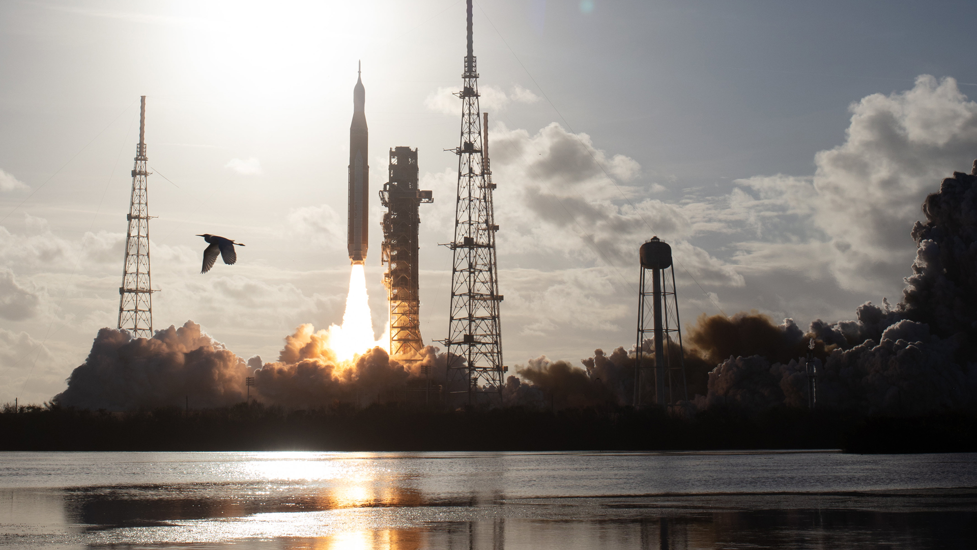 The NASA Space Launch System rocket carrying the Orion spacecraft with NASA astronauts Reid Wiseman, commander; Victor Glover, pilot; Christina Koch, mission specialist; and CSA (Canadian Space Agency) astronaut Jeremy Hansen, mission specialist aboard the Artemis II mission launches.