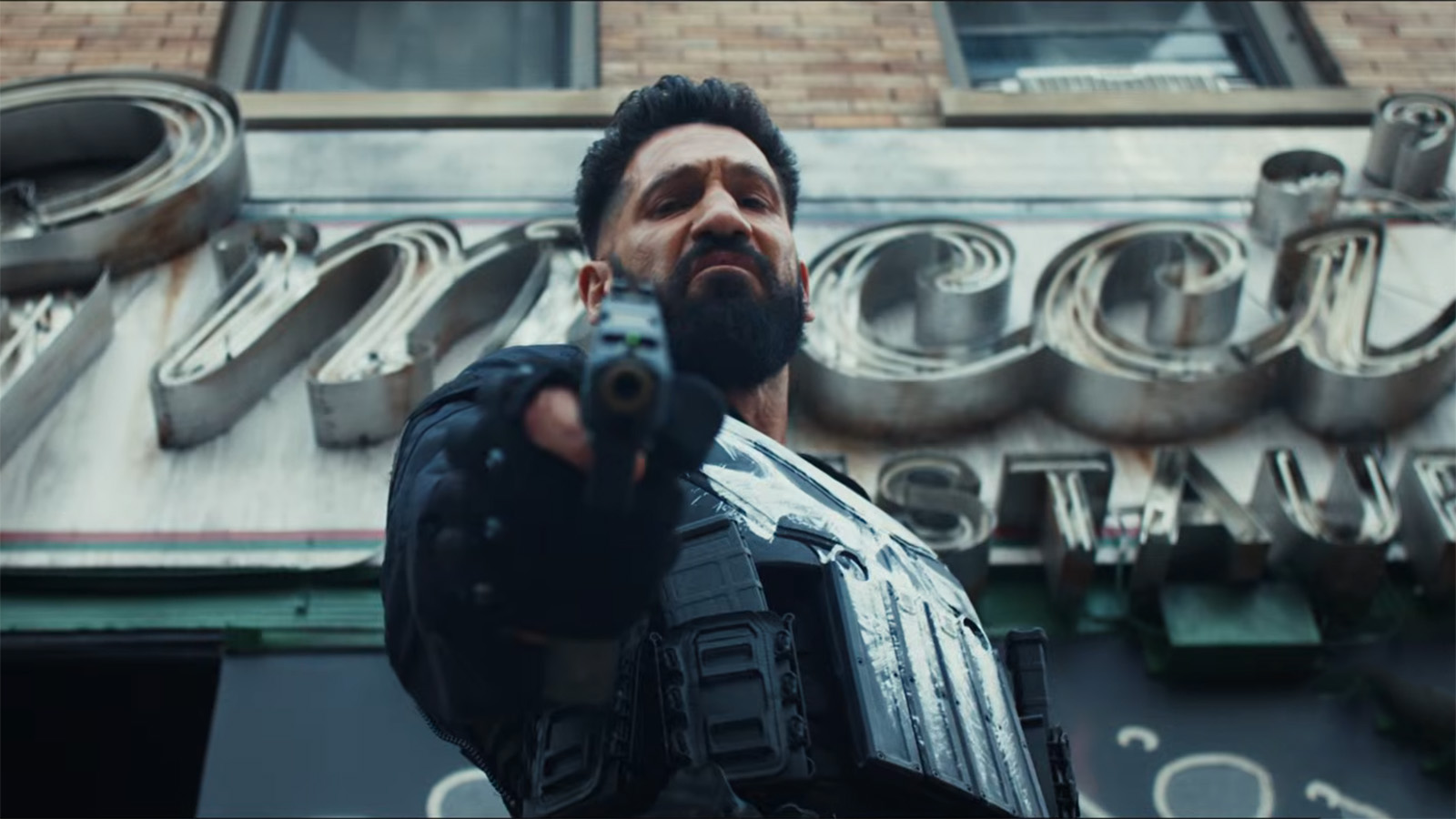 Frank Castle pointing a sawed-off shotgun directly at the camera in The Punisher: One Last Kill