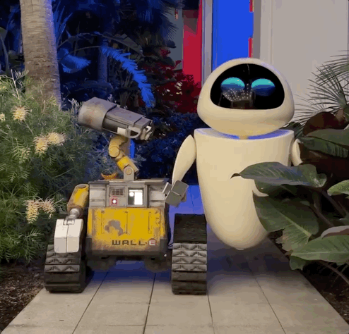 Robot characters Wall-E and Eve roam the Pixar Place Hotel at Disneyland Resort.