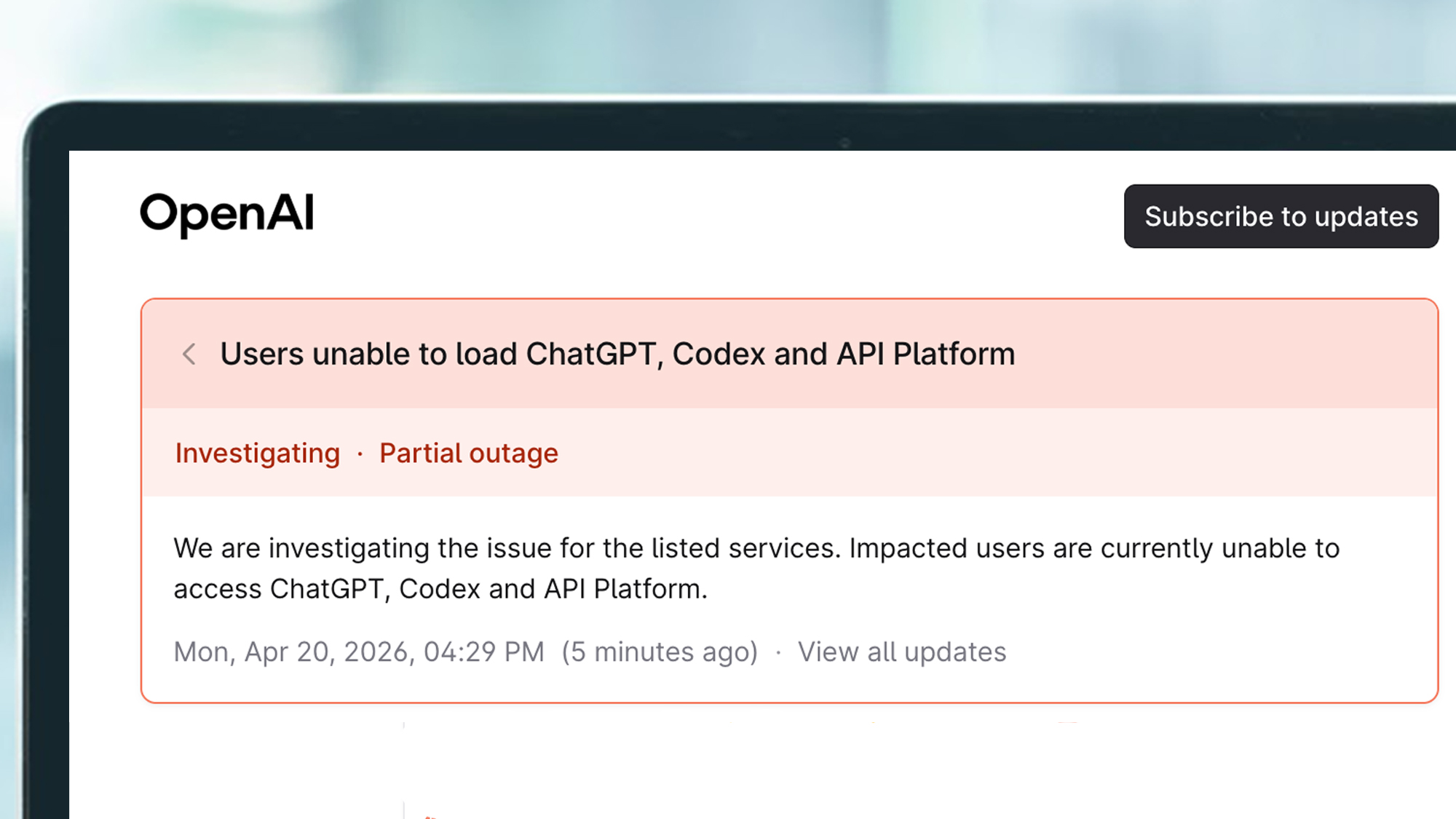 A laptop screen showing a message on the OpenAI status page during an outage