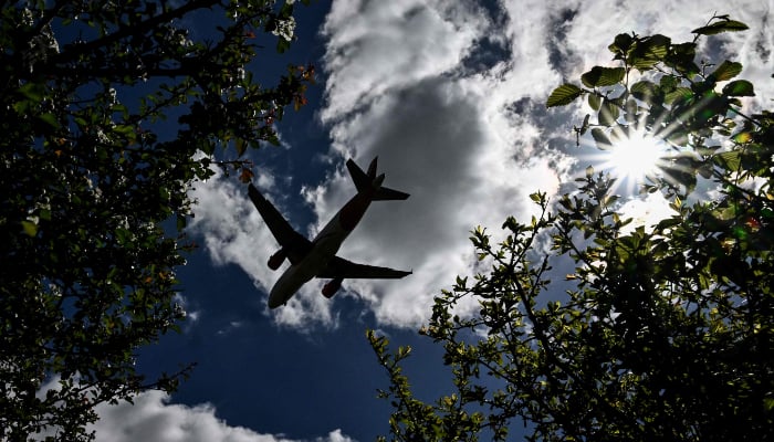 A passenger plane prepares to land at London Gatwick airport, near Crawley, southern England, on April 20, 2026. — AFP