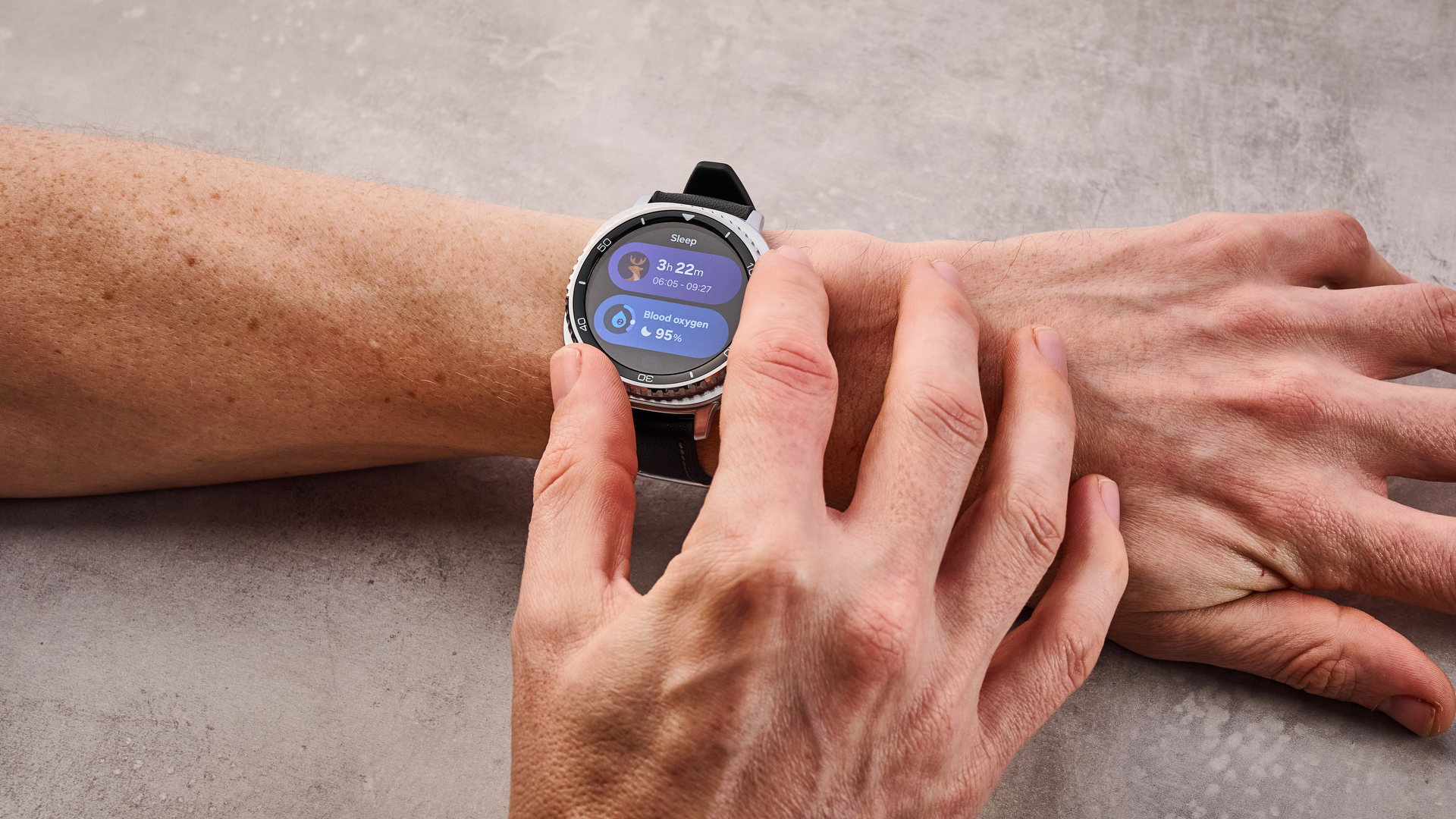 The Samsung Galaxy Watch 8 Classic on a man's wrist; Turn your dial to select your sleep functions.