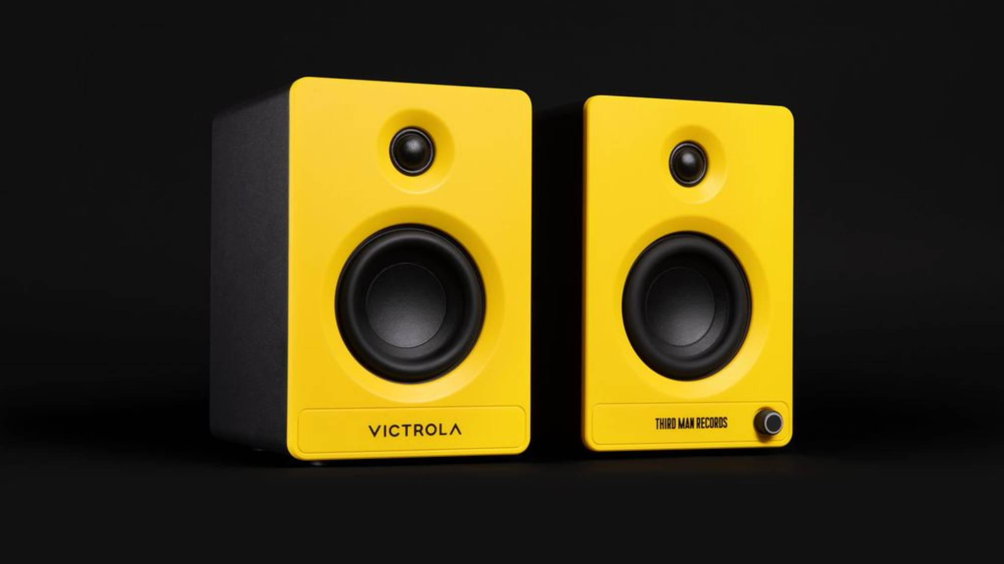 A close up of Victrola Tempo speakers in black and yellow