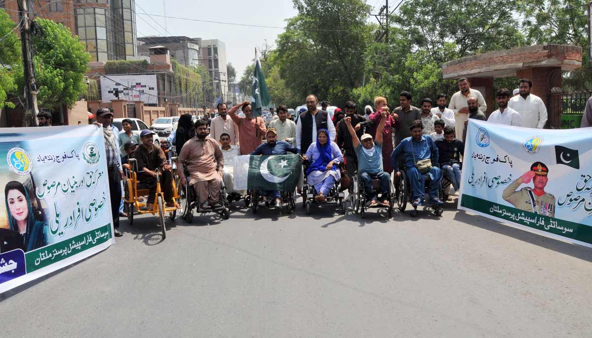 Disabled people under the banner of Society for Special Persons take part in a rally to commemorate Marka-e-Haq and express solidarity with the Pakistan Armed Forces in Multan. - APPLICATION