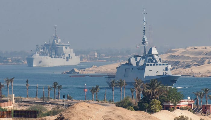 An image released by the Marine Nationale (French Navy) on May 6, 2026 shows the French Navy's carrier strike group, including the flagship aircraft carrier Charles de Gaulle (unseen) and its escort transiting the Suez Canal en route to the southern Red Sea to pre-position for a possible mission to restore navigation in the Strait of Hormuz. — AFP