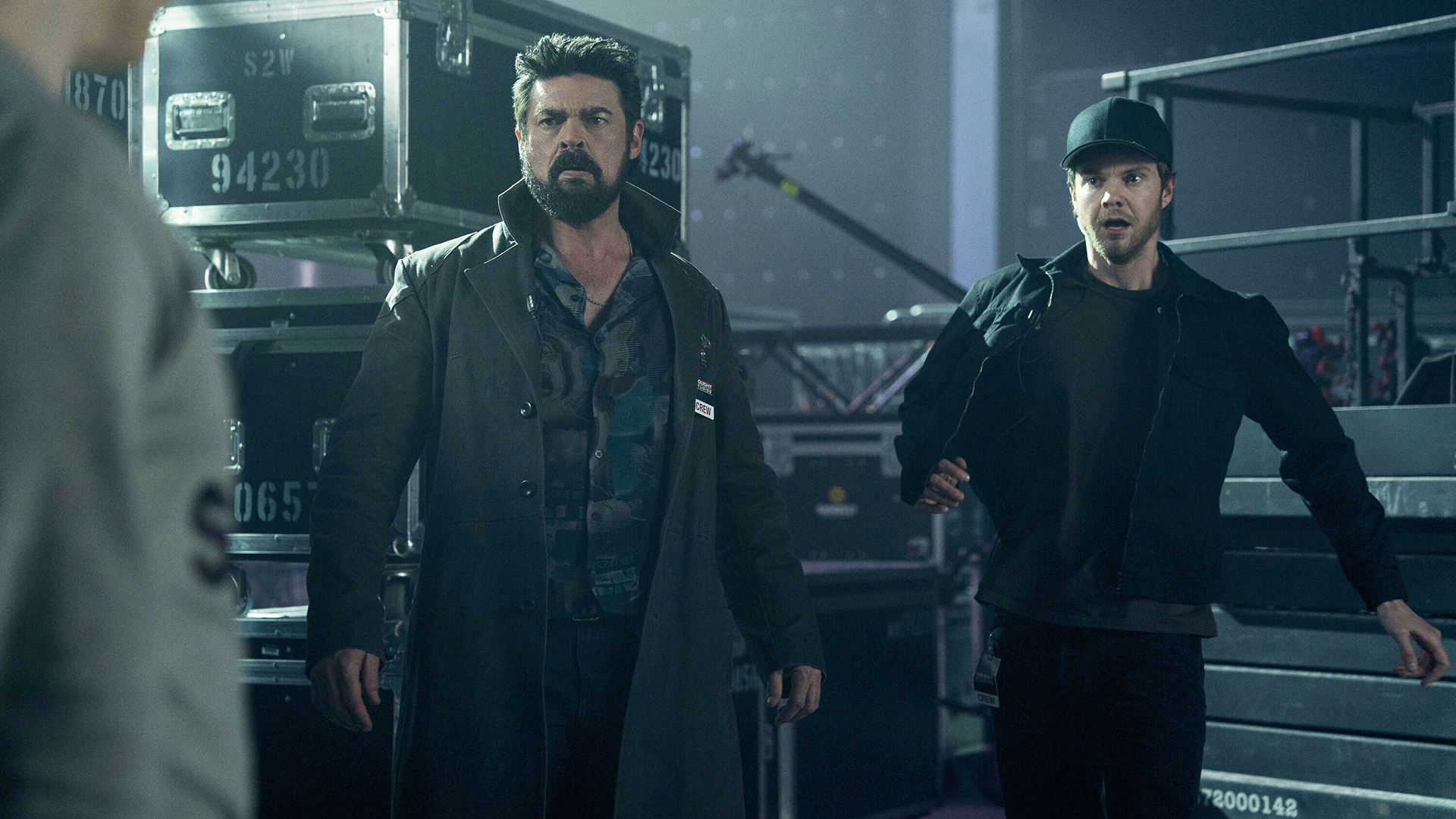 Billy and Hughie look surprised at someone off camera in The Boys season 5, episode 7.