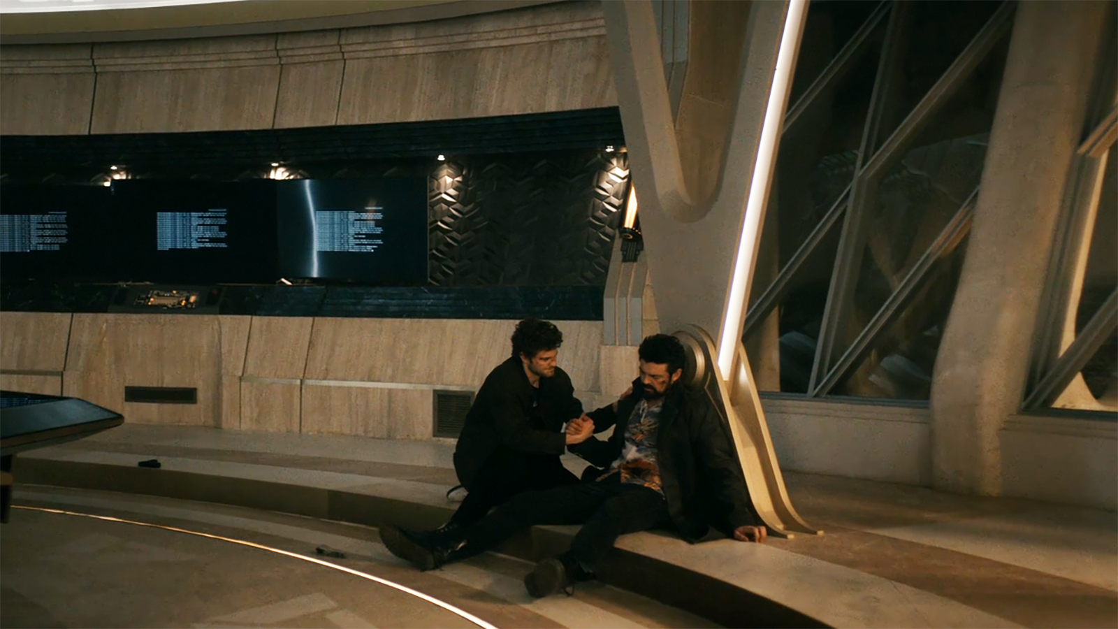 A wide shot of Hughie holding the hand of a dead butcher in Vought Tower in The Boys season 5 finale.