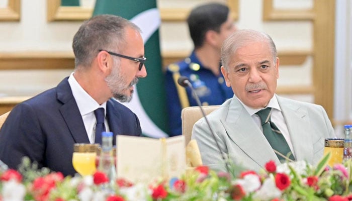 Prince Rahim Aga Khan V speaks with Shehbaz Sharif during a breakfast meeting at the Prime Minister's House in Islamabad on May 21, 2026. - PID