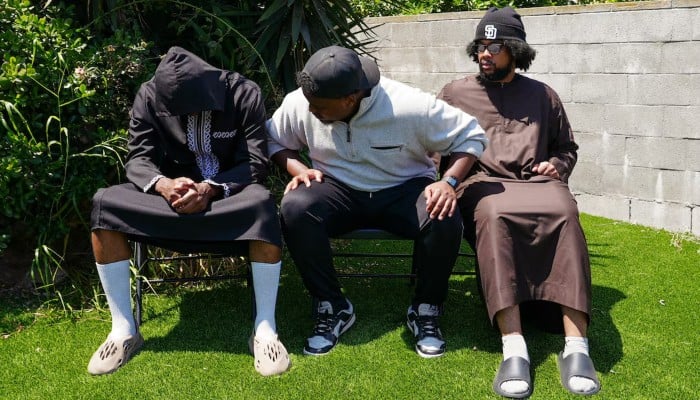 Jibril Abdullah, Mohammed Abdullah and Khalid Abdullah, sons of security guard Amin Abdullah, who was killed in a shooting, sit outside their home in San Diego, California, US, May 20, 2026. – Reuters