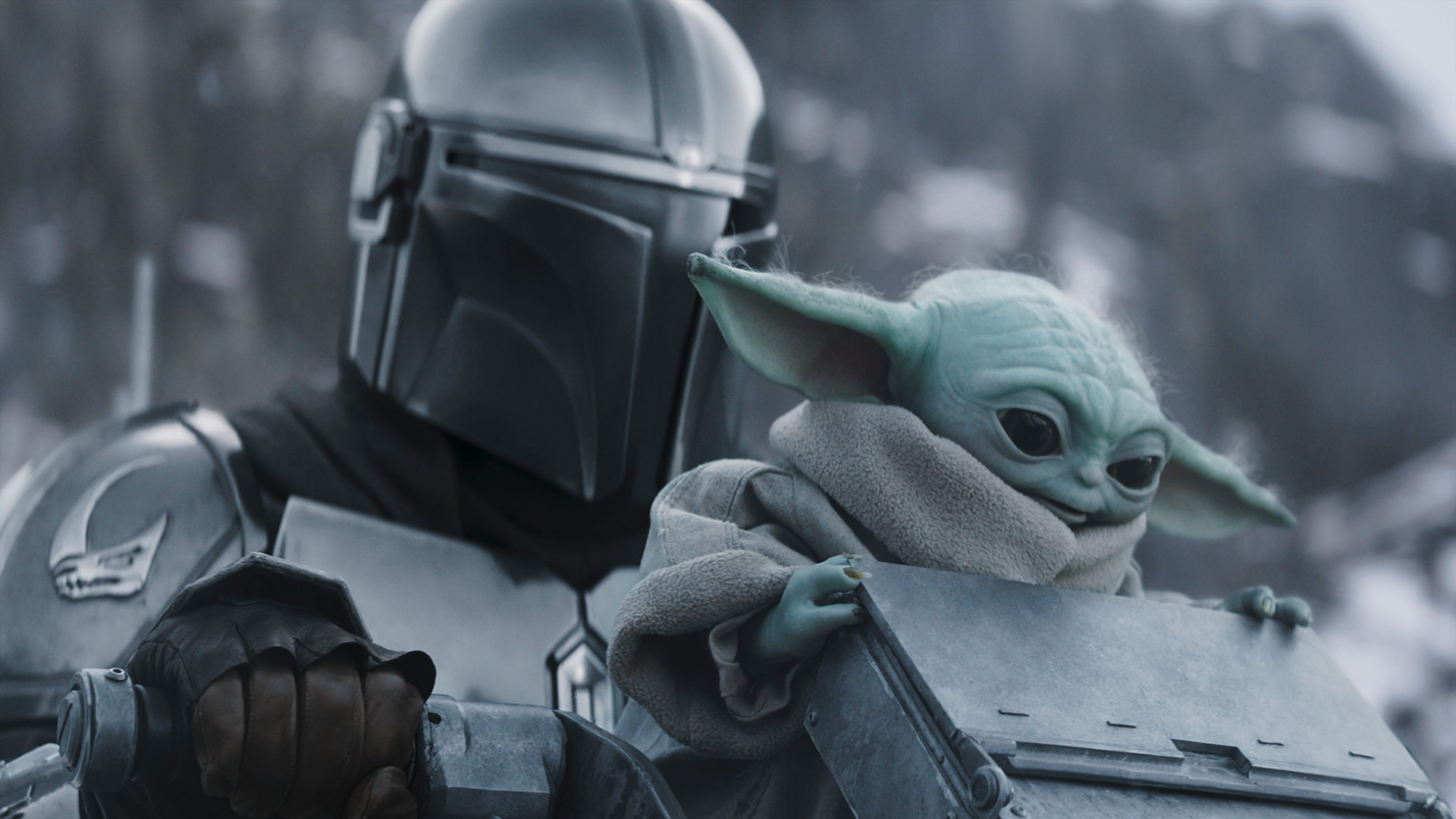 A close-up of Din Djarin and Baby Yoda in The Mandalorian and Grogu