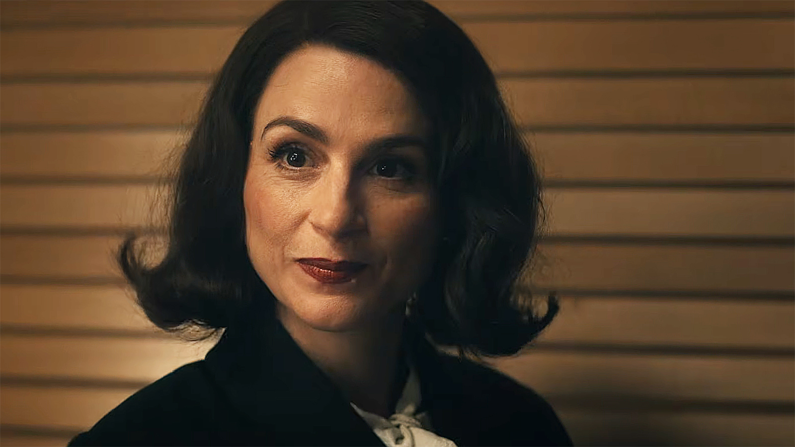 Aya Cash's Clara Vought/Liberty looking at a child soldier off-camera in Vought Rising