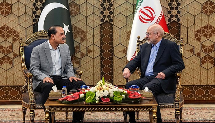 Iranian Parliament Speaker Mohammad Bagher Ghalibaf (R) meets with Defense Forces Chief and Army Chief of Staff Field Marshal Asim Munir in Tehran on May 23, 2026. – Reuters