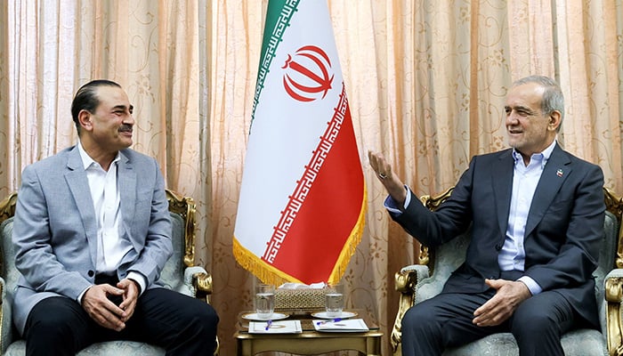 Iranian President Masoud Pezeshkian (right) meets with Defense Forces Chief and Army Chief of Staff Field Marshal Asim Munir in Tehran on May 23, 2026. – Reuters