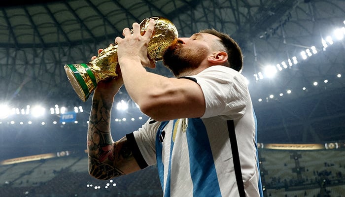 Argentina's Lionel Messi kisses the trophy as he celebrates winning the World Cup, FIFA World Cup Qatar 2022 - Final - Argentina v France - Lusail Stadium, Lusail, Qatar - December 18, 2022. - Reuters