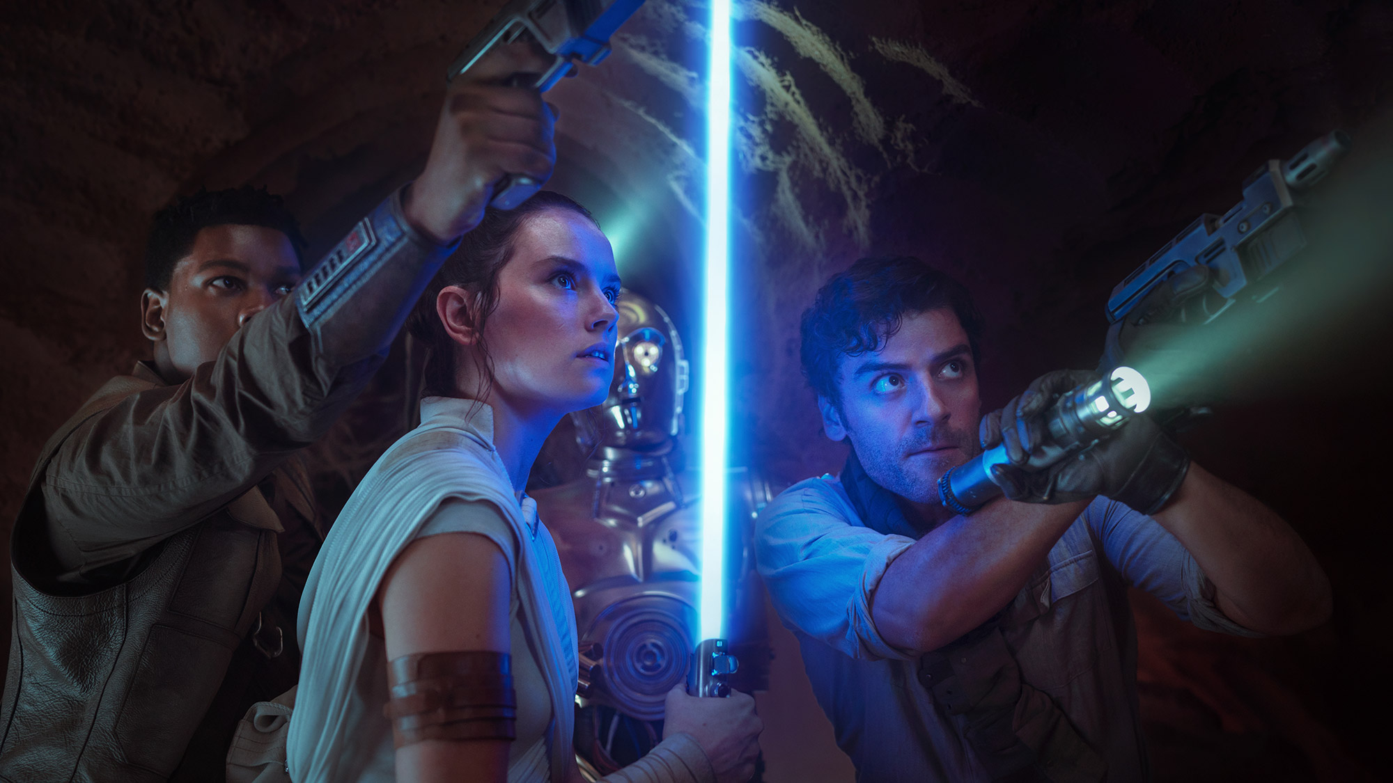 Finn, Rey, C-3PO and Poe looking at something off camera in Star Wars Episode IX: The Rise of Skywalker