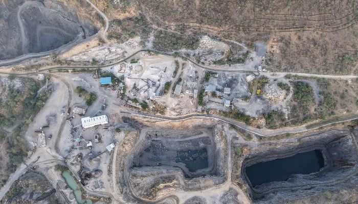 This aerial photograph, taken on May 18, 2026, shows an open-pit stone quarry in the Aravalli range in the city of Neem ka Thana in Rajasthan. — AFP