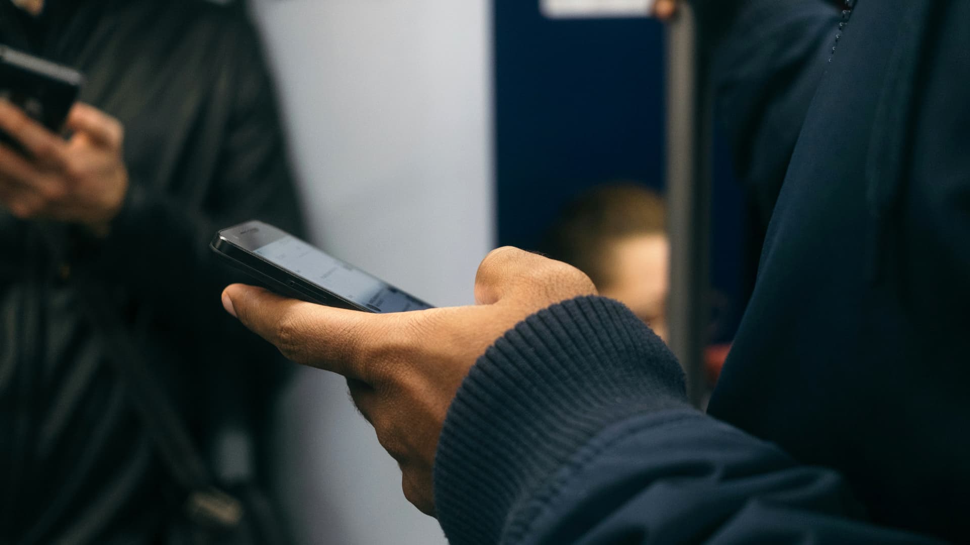 A person holding a smartphone.
