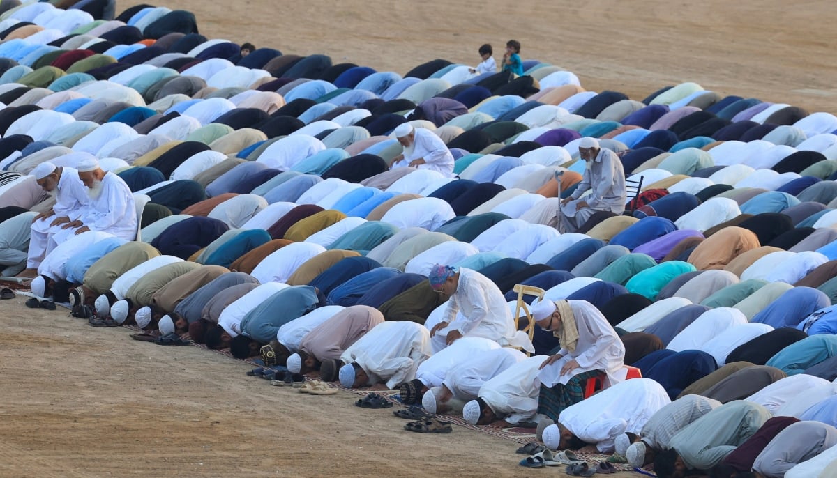 People offer Eid ul Adha prayers at Railway Ground in Karachi, May 27, 2026. - Reuters