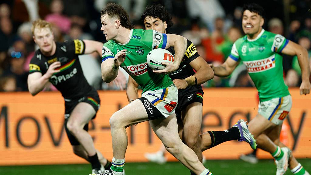 Canberra Raiders' Ethan Strange runs away from Penrith Panthers defense in NRL 2025